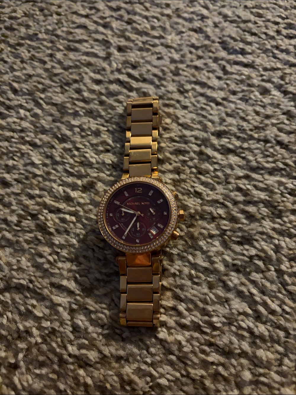 Michael Kors. Rose Gold dark purple face…..